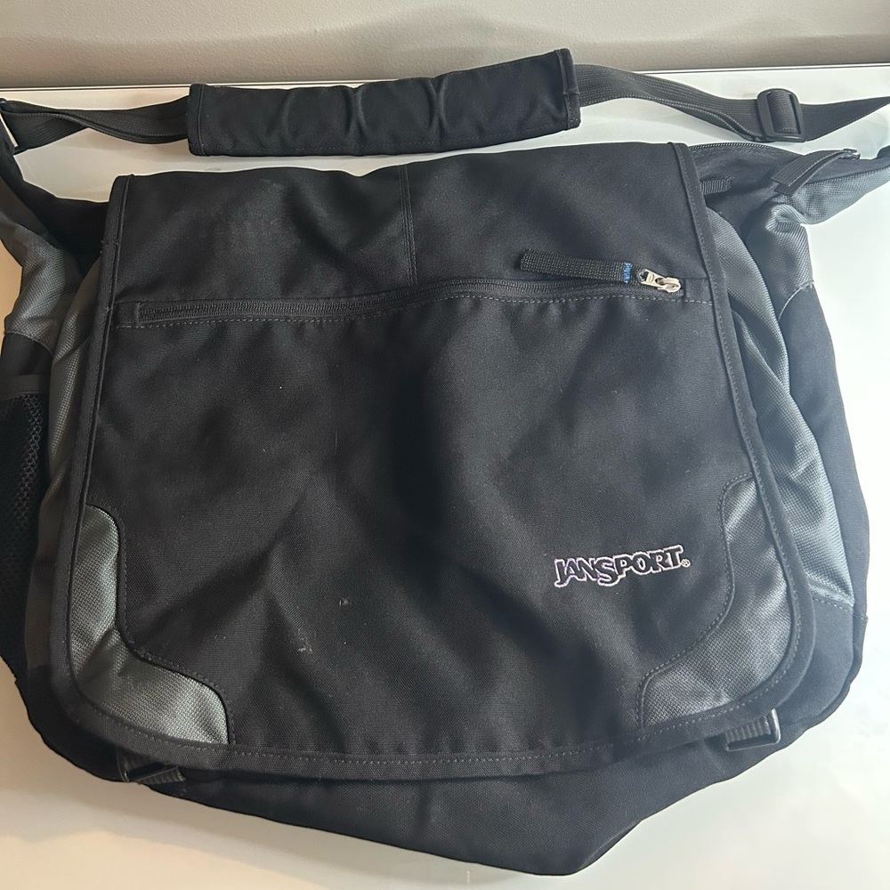 JanSport Black Messenger Bag with Durable Design and Multiple Compartments
